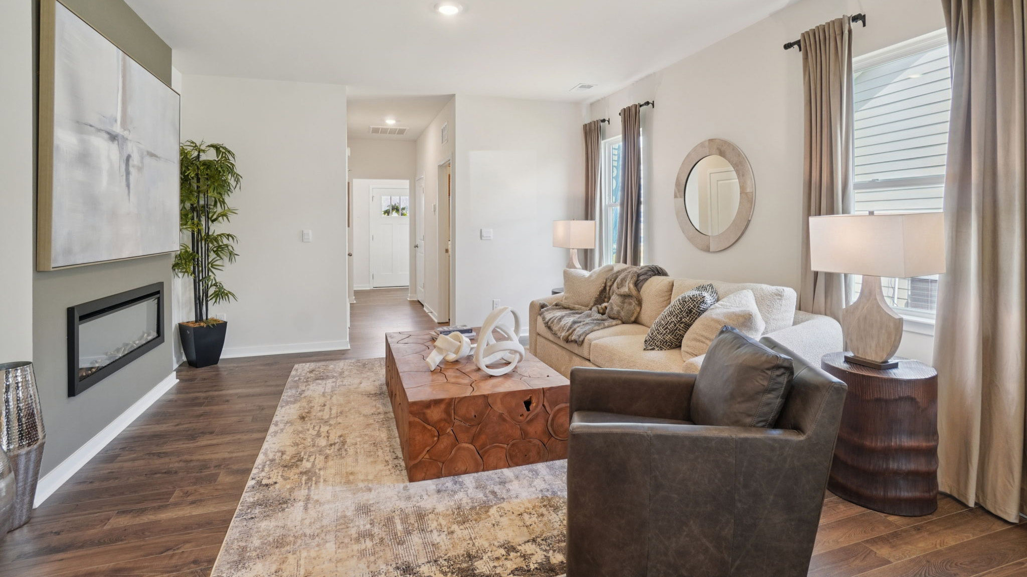 Open concept living area with electric fireplace