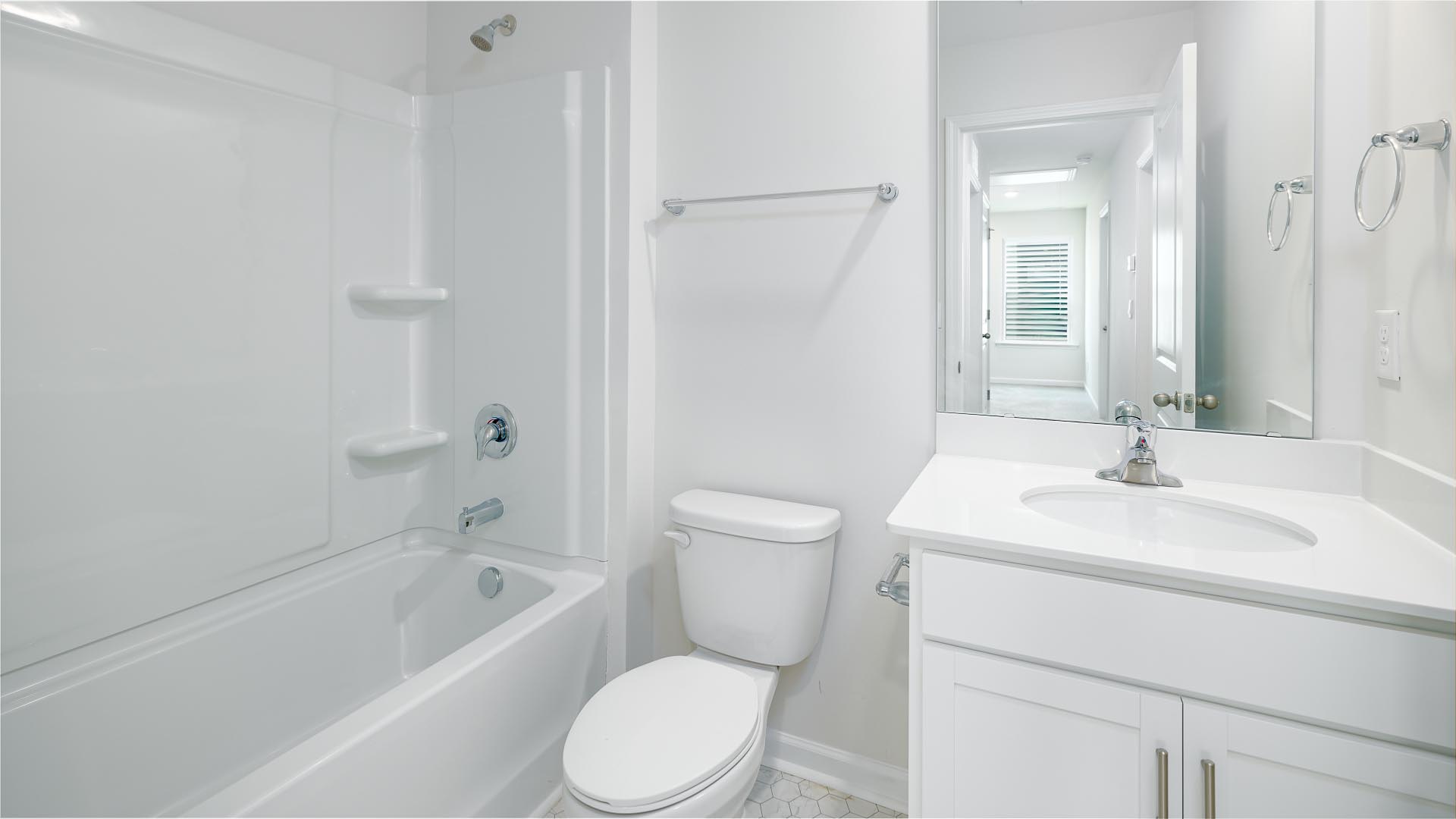 Bathroom with single vanity and bathtub