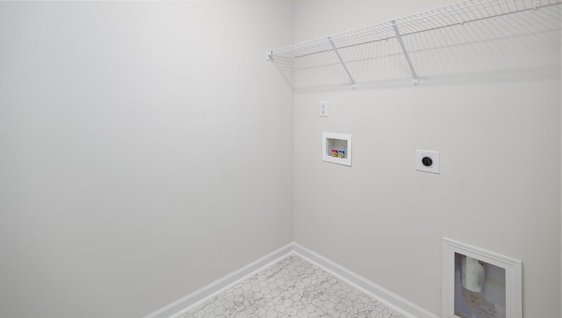 Laundry room with shelving