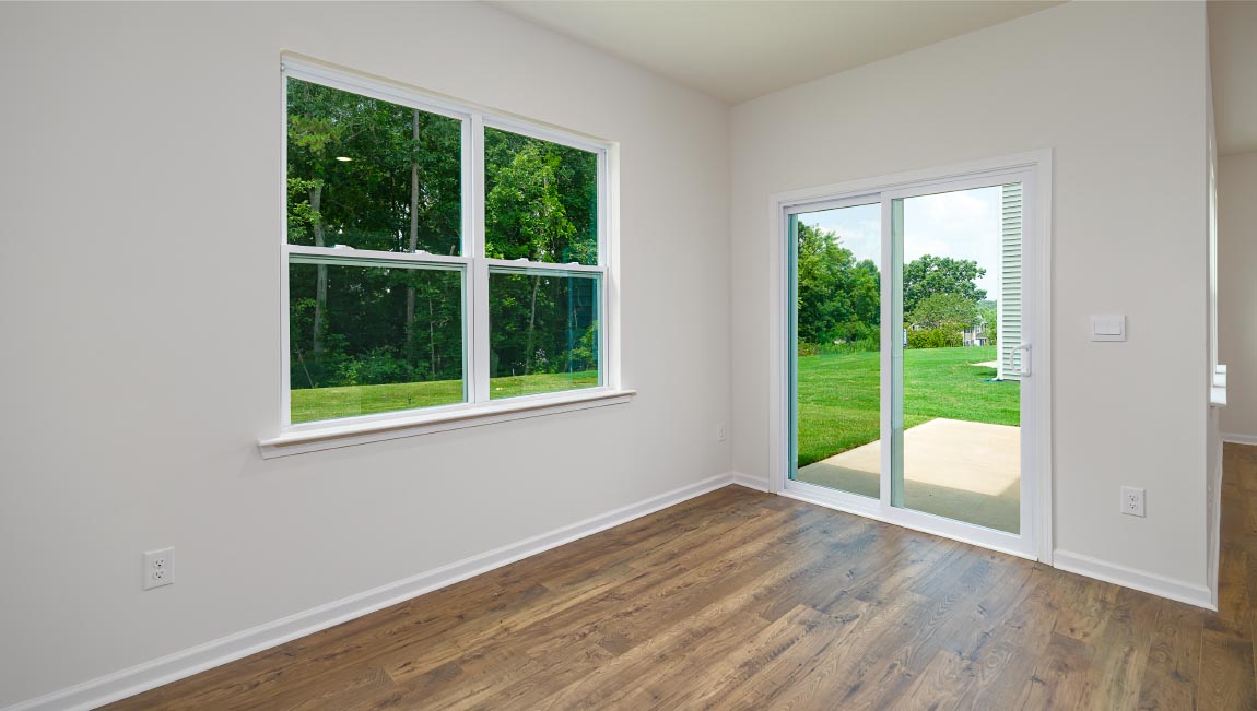 Open dining area with large window and sliding glass doors