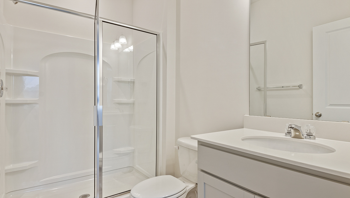 Primary bedroom suite with closet and bath