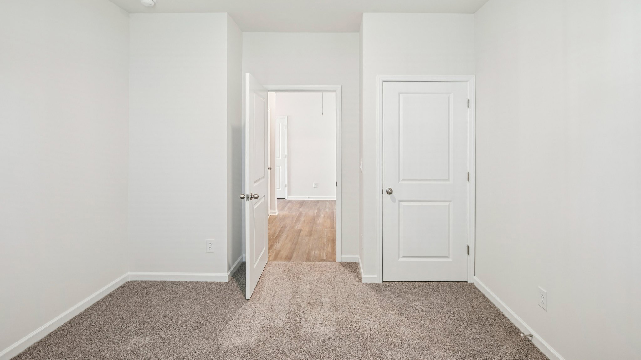 Bedroom with carpet and white walls