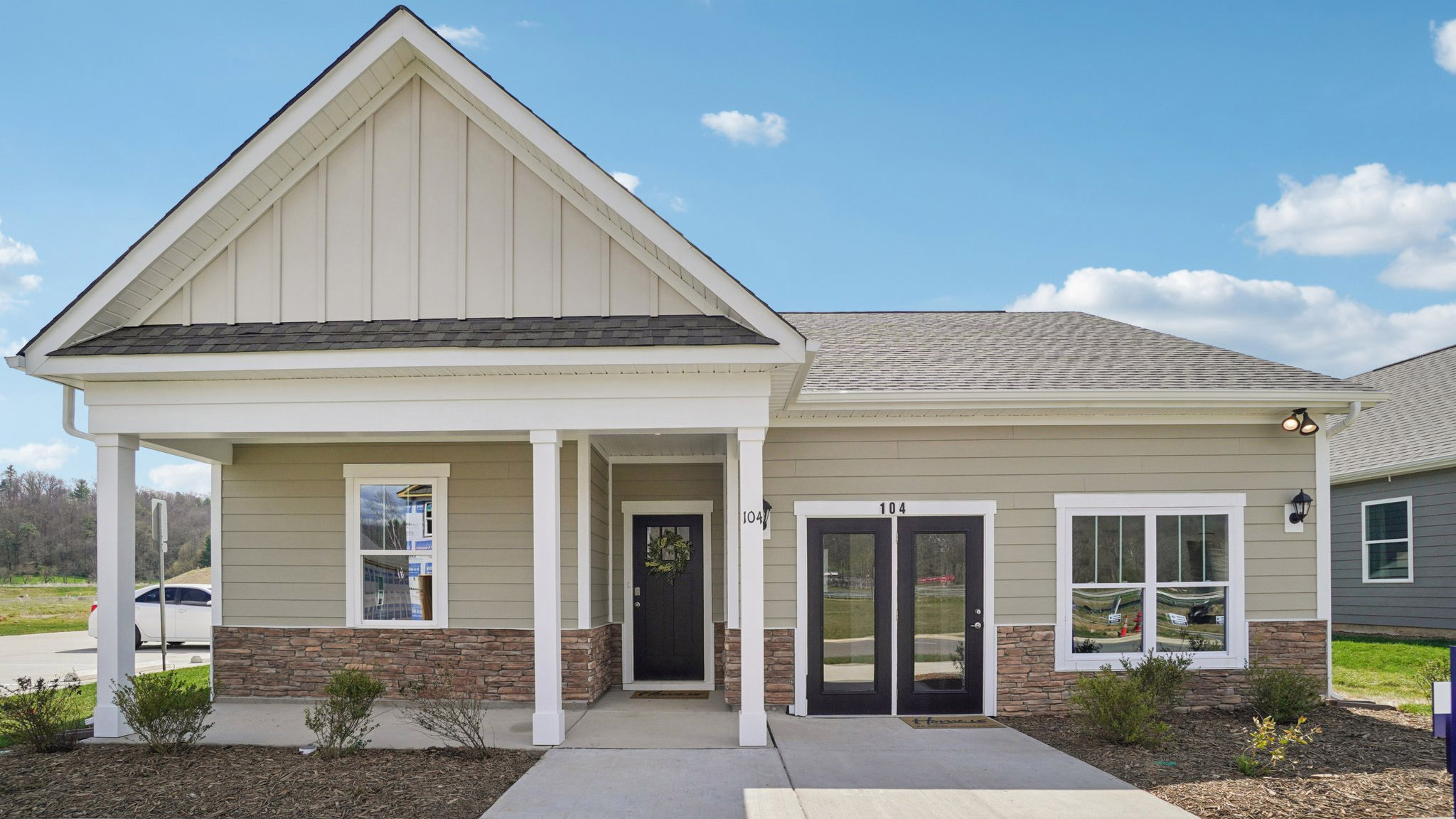 Exterior view of Cali Q plan with covered front porch