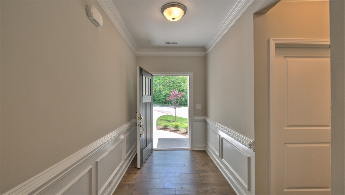 Welcoming foyer with interior view of front door