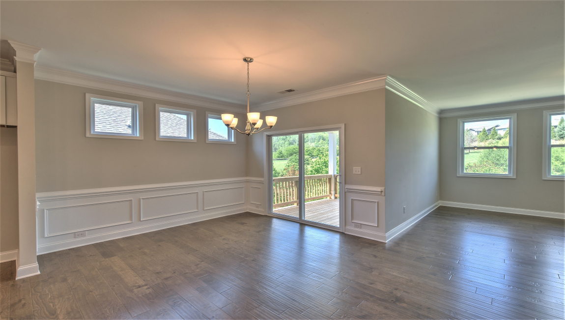Open concept living and dining space with sliding glass door