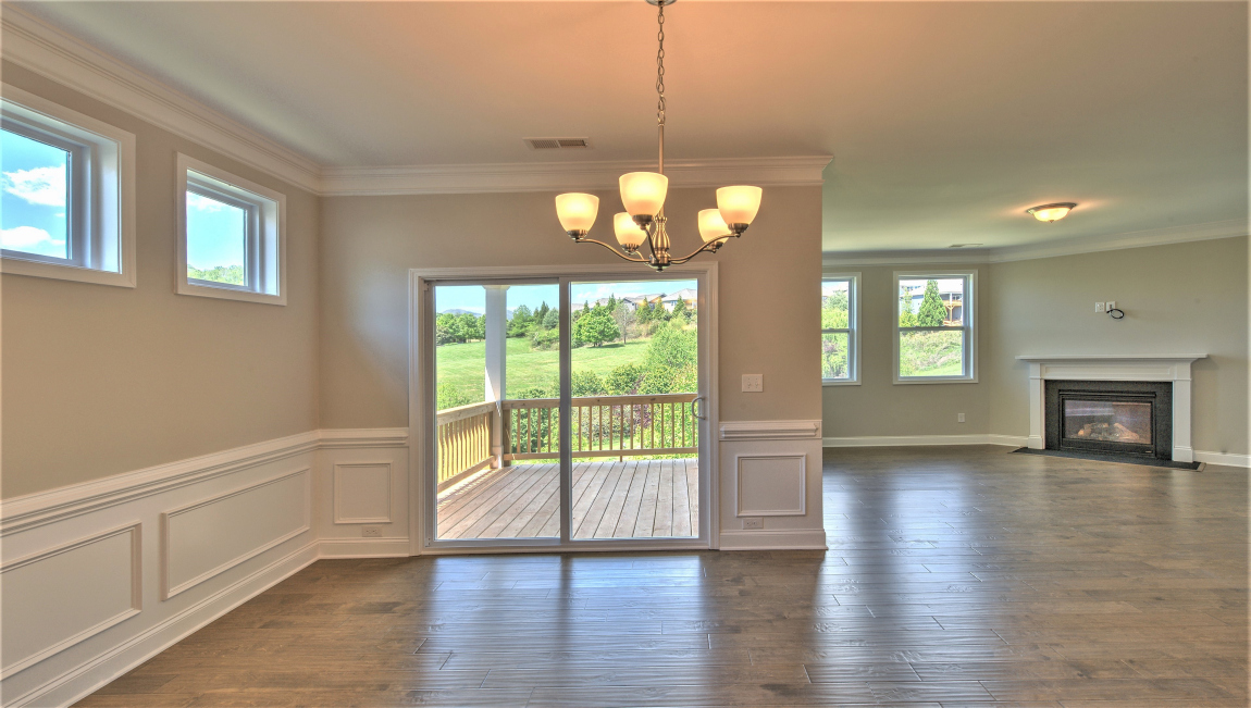 Open concept living and dining space with sliding glass door