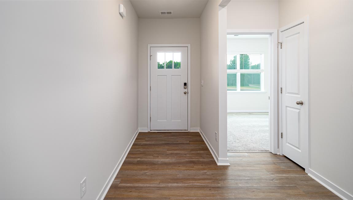 Welcoming foyer with wood floors, view of home interior