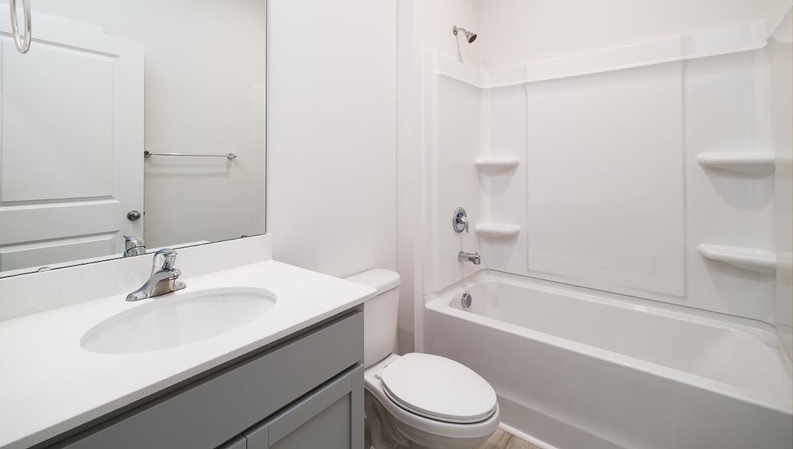 Bathroom with single vanity and bathtub