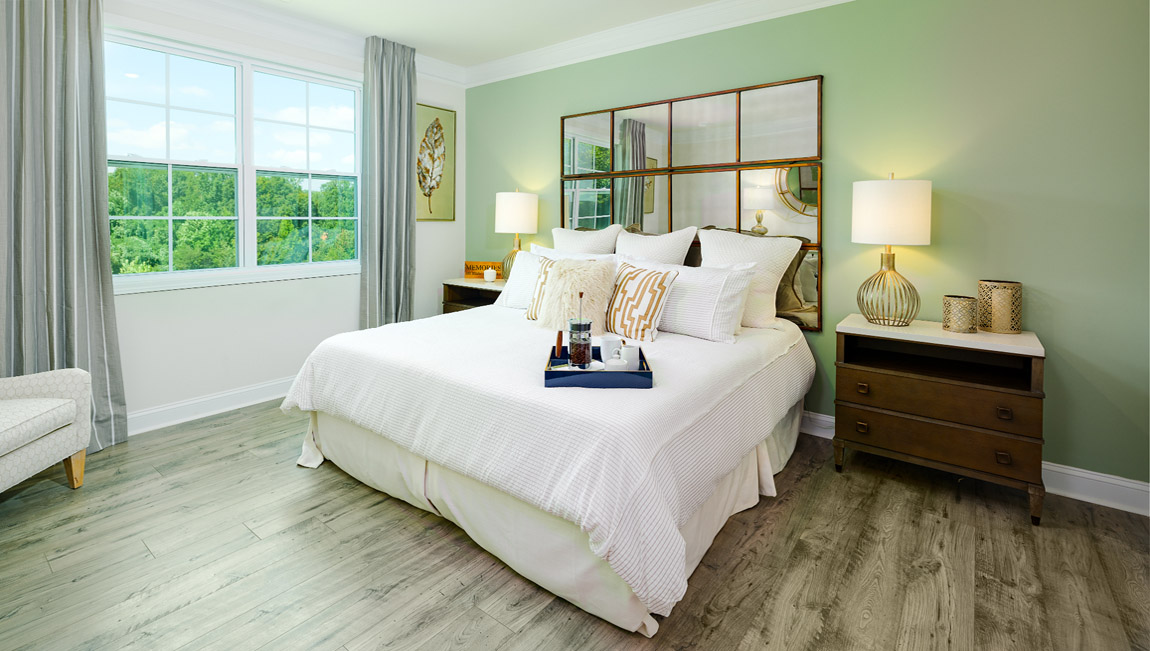 Primary bedroom with large windows