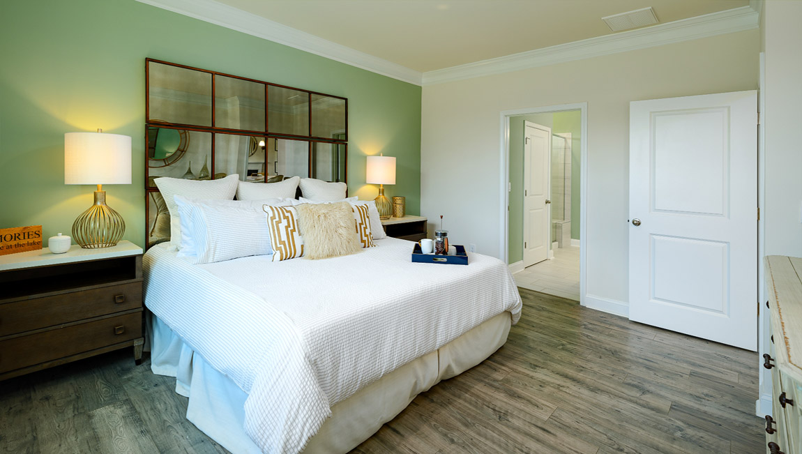 Primary bedroom with large windows