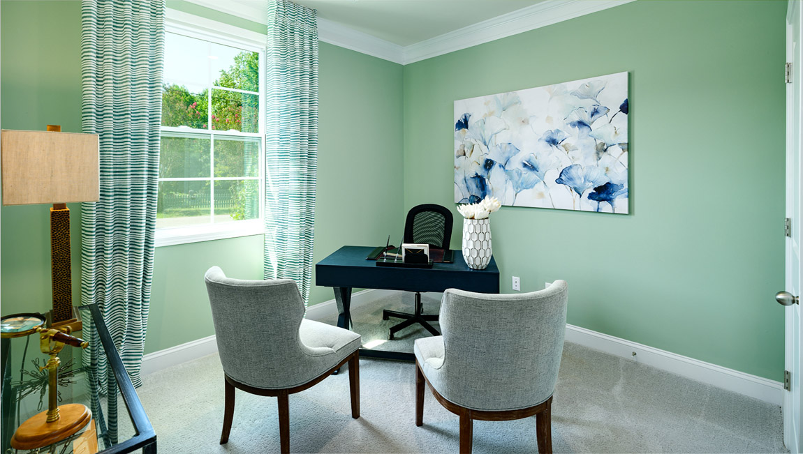 Carpeted bedroom with large window