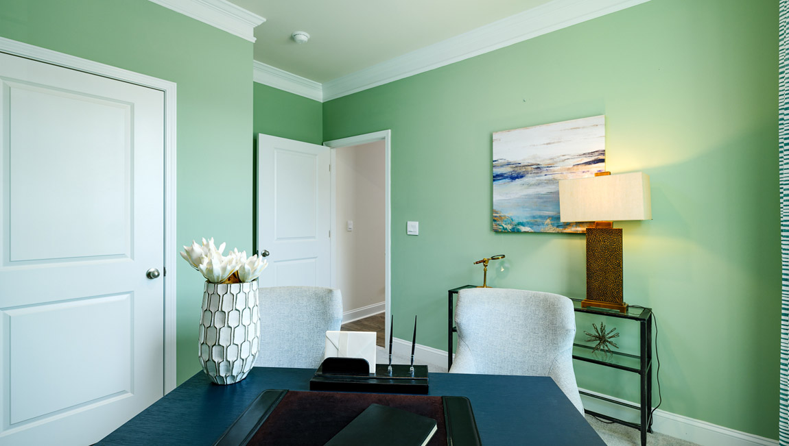 Carpeted bedroom with large window