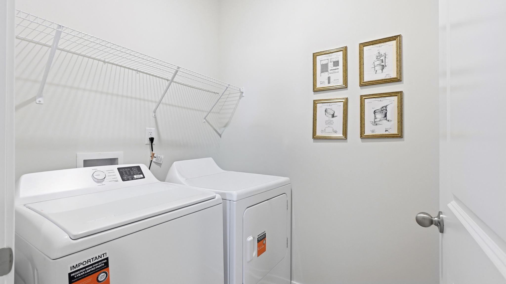 Laundry room with washer, dryer and shelving