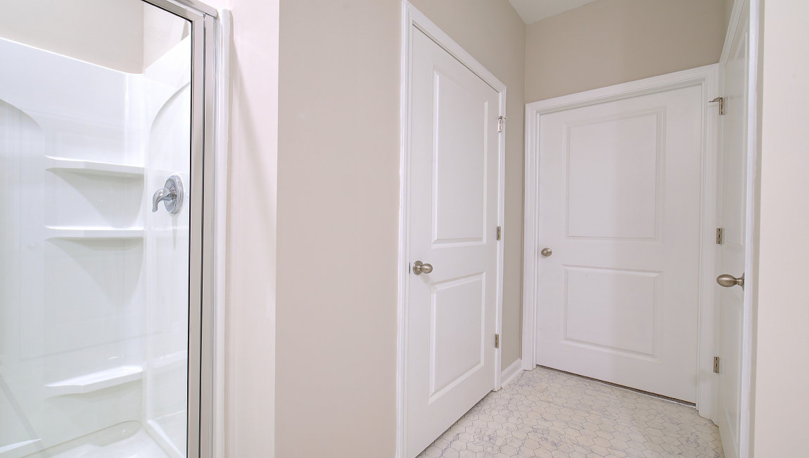 Bathroom primary with double vanity and walk in shower