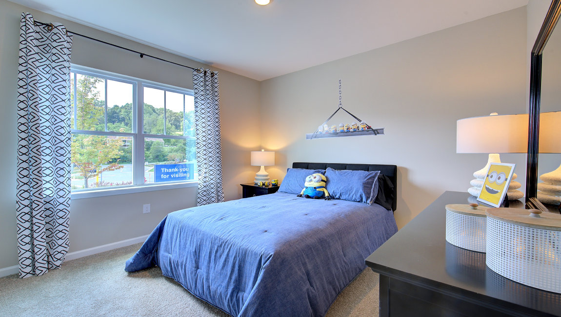 Carpeted bedroom with window