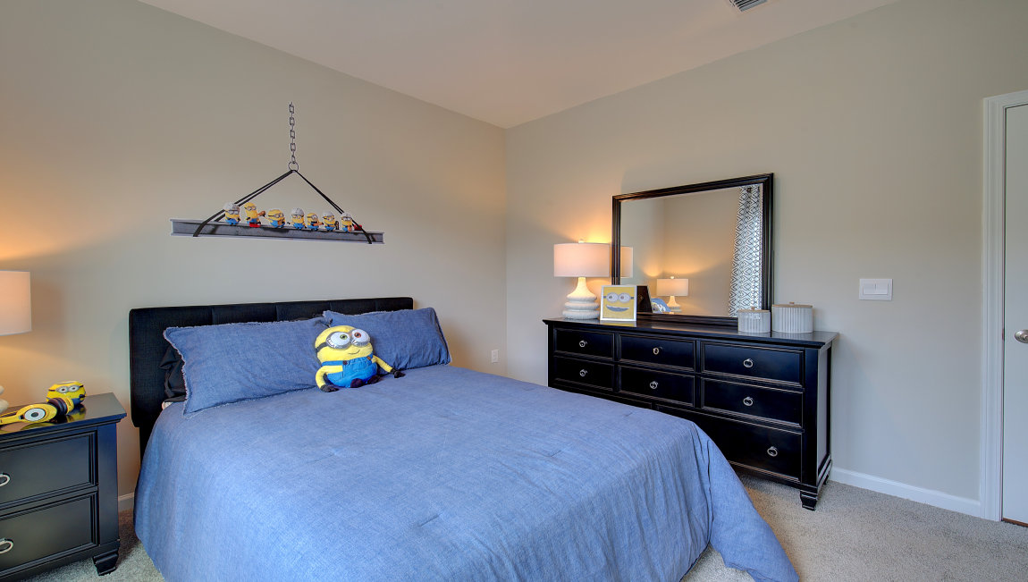 Carpeted bedroom with window
