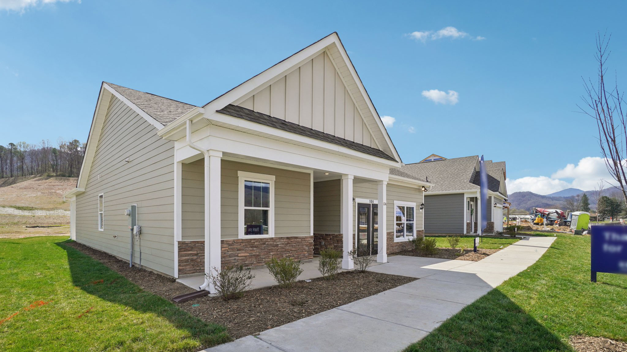 Exterior view of Cali Q plan with covered front porch