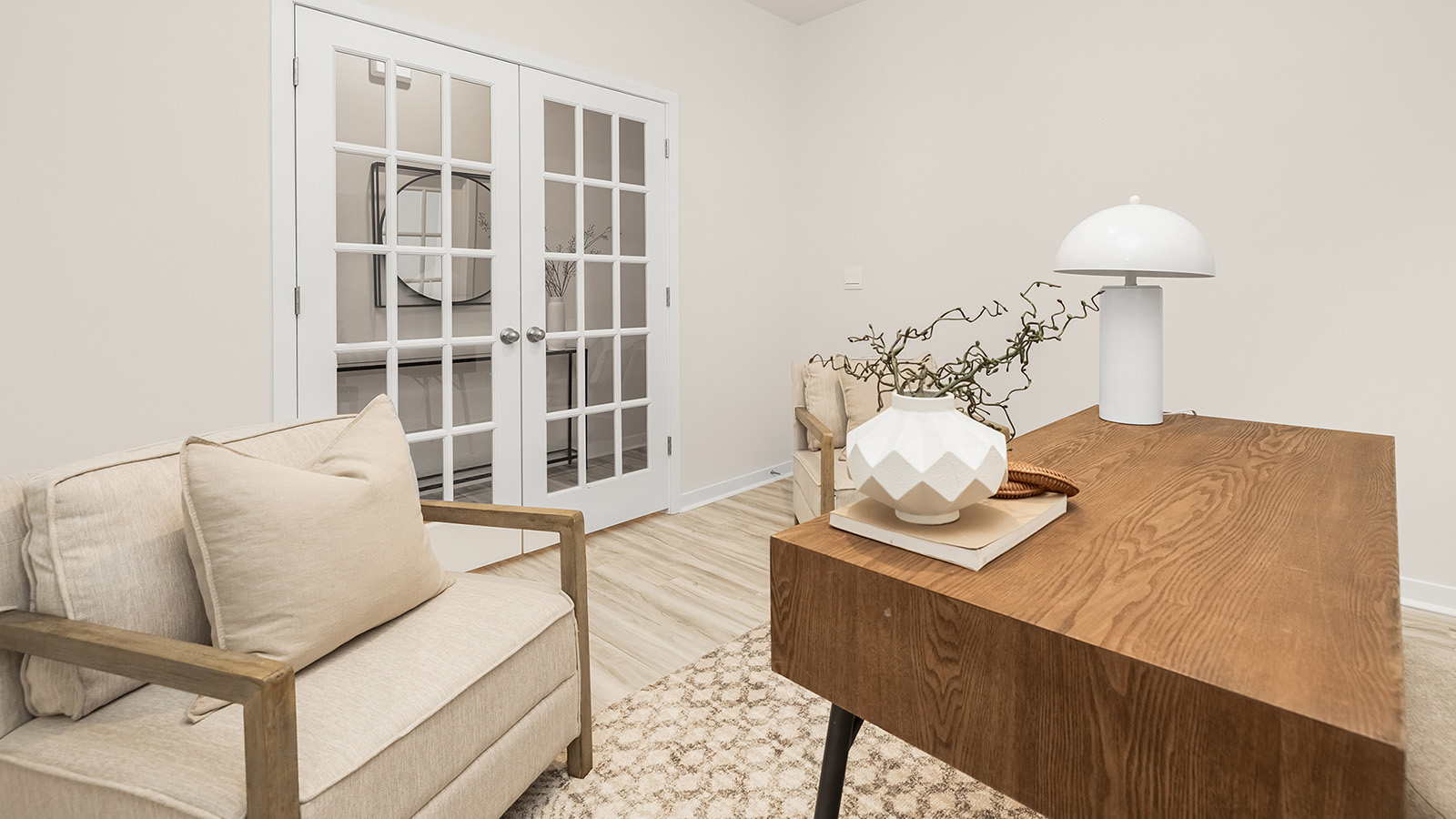 office space with wood floors and large window