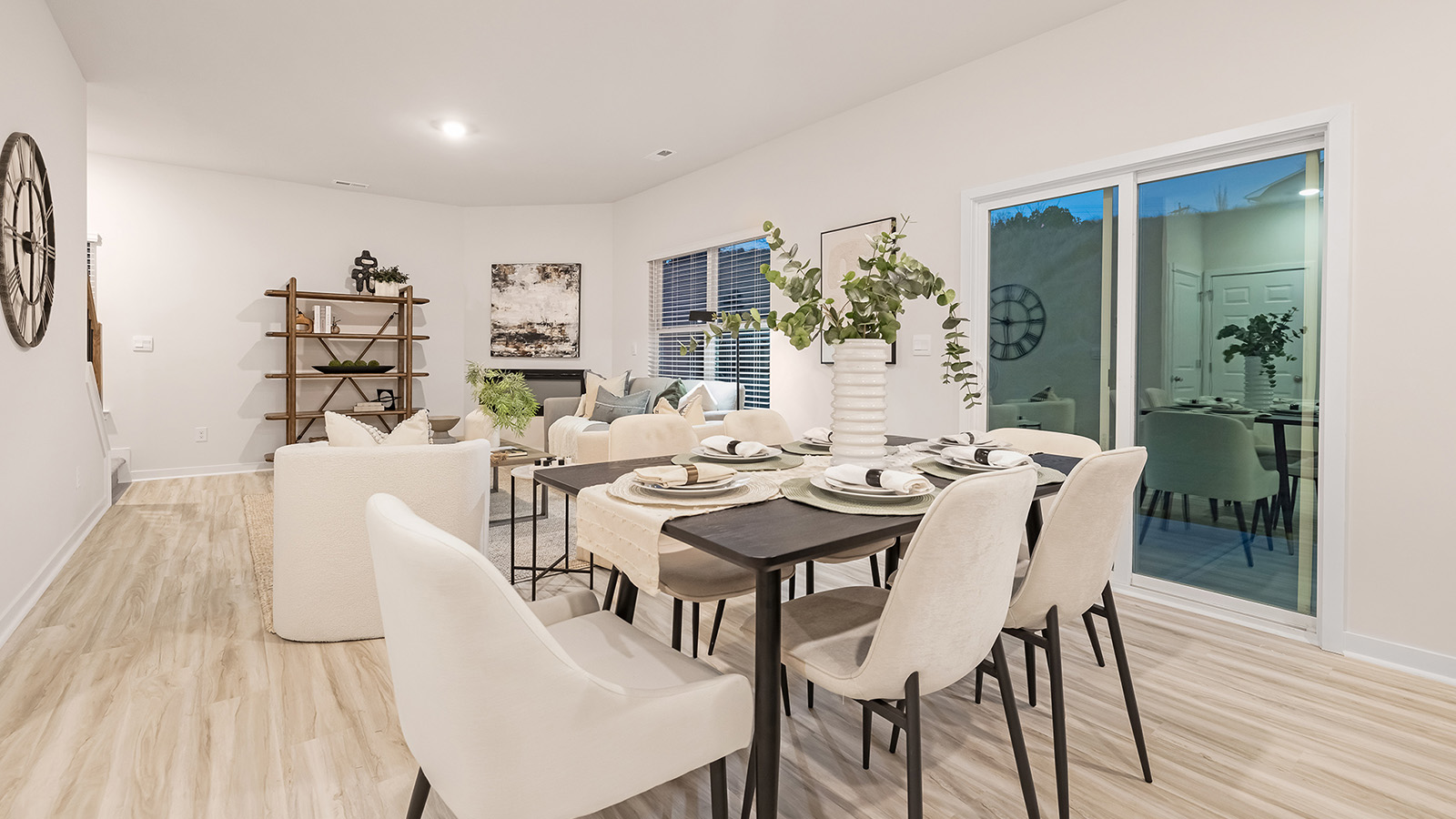 Dining room with wood floors, and sliding glass back door