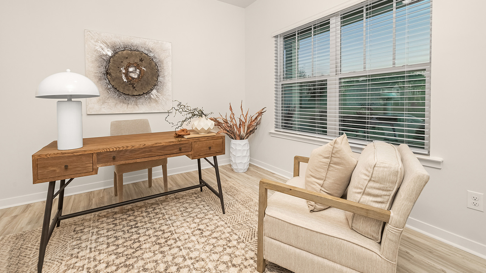office space with wood floors and large window