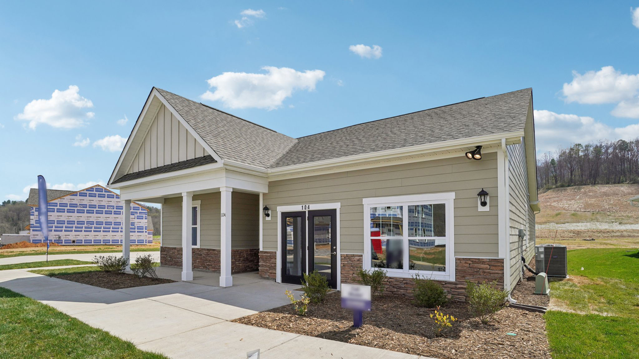 Exterior view of Cali Q plan with covered front porch
