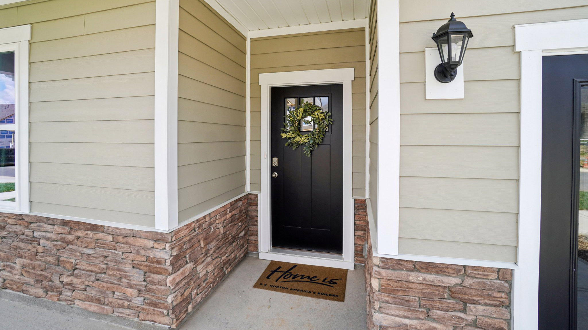 Close up front exterior view of Cali Q plan