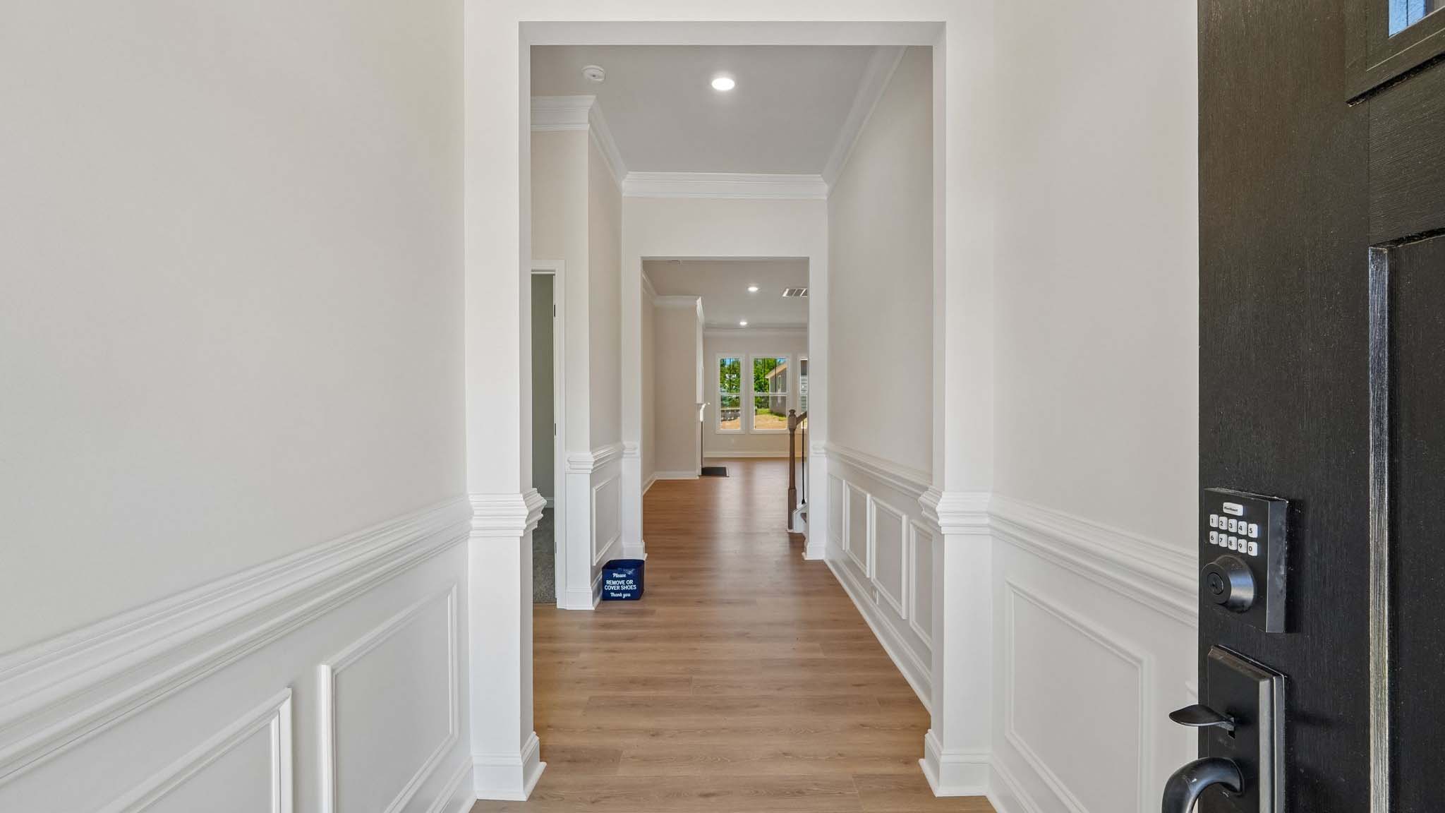 Welcoming foyer with wood floors