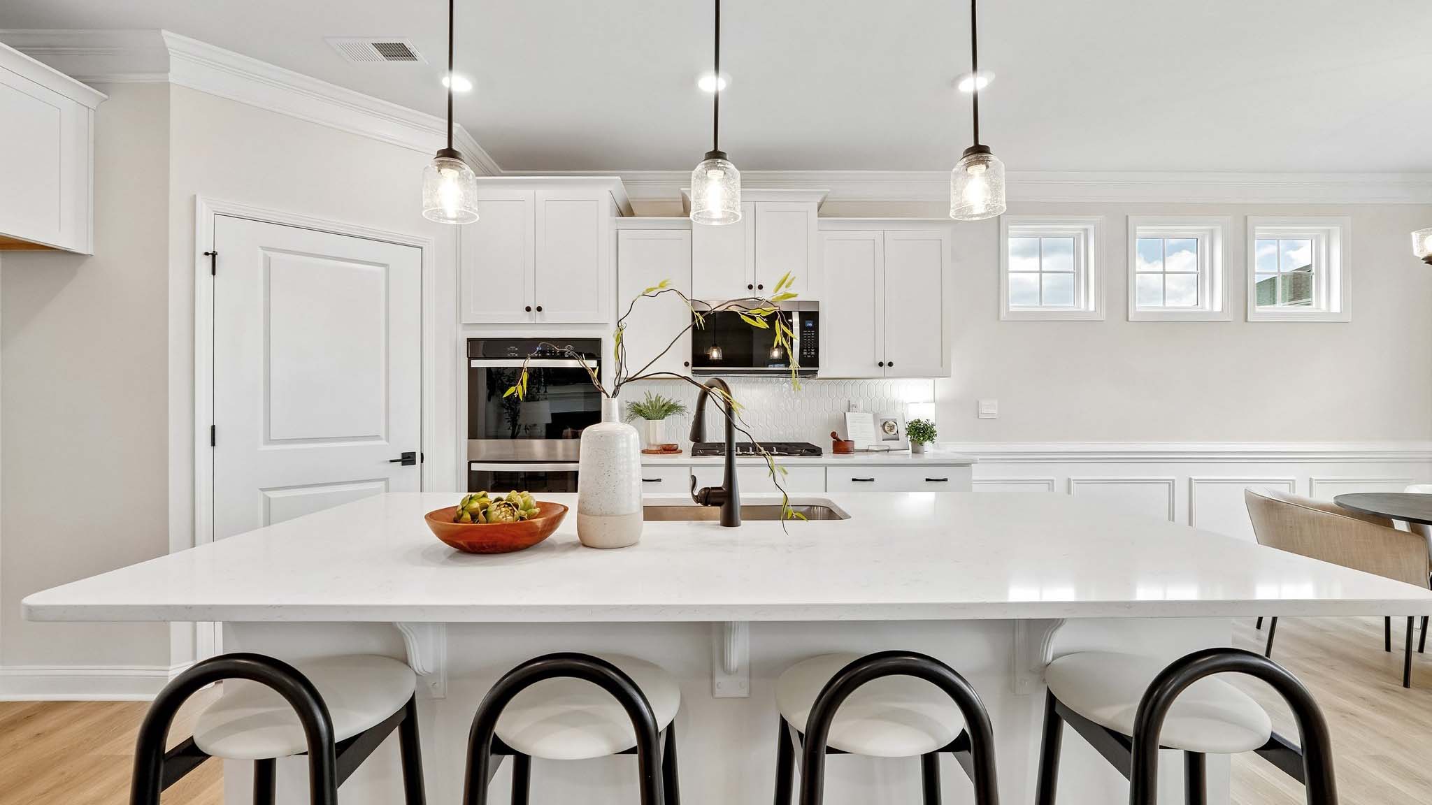 kitchen and island with stainless steel appliances