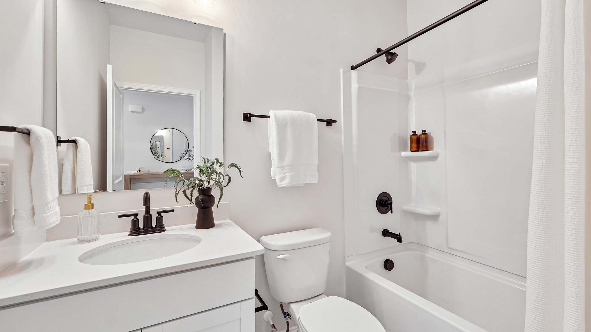 bathroom with bathtub shower combination
