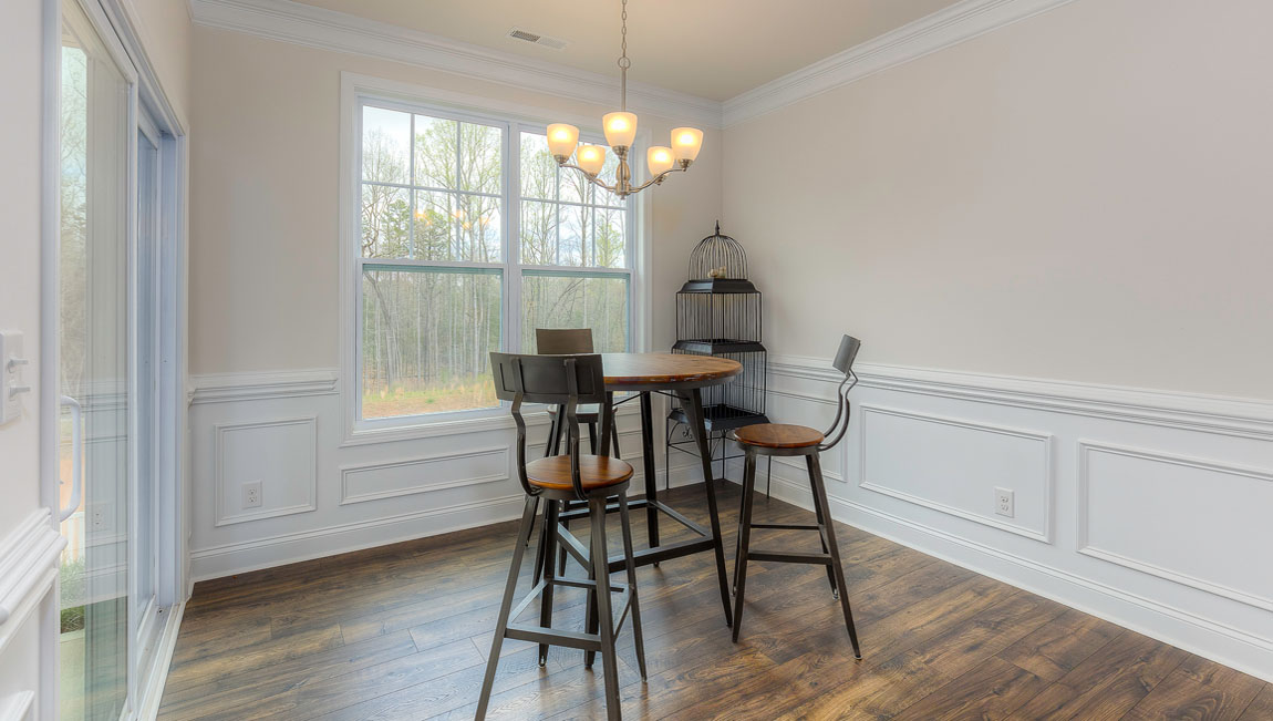 Breakfast area beside kitchen living room, and  sliding glass back door
