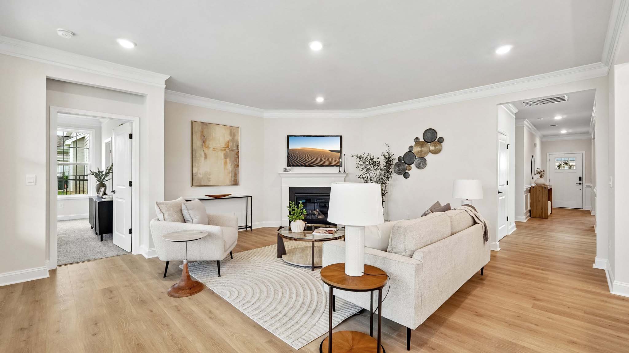 Living room beside kitchen with fireplace