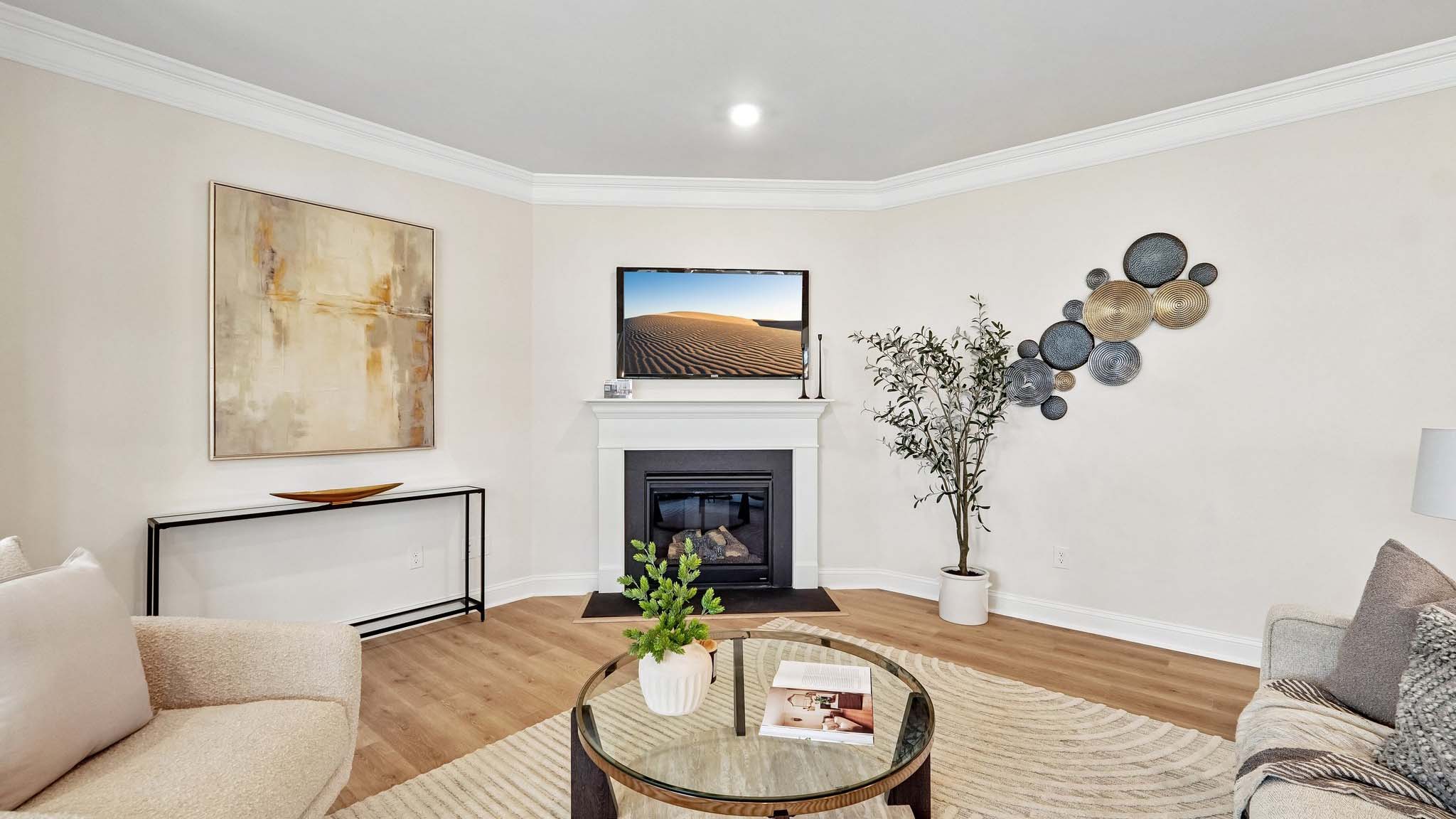 Living room beside kitchen with fireplace