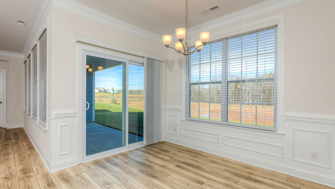 Breakfast area beside kitchen living room, and  sliding glass back door