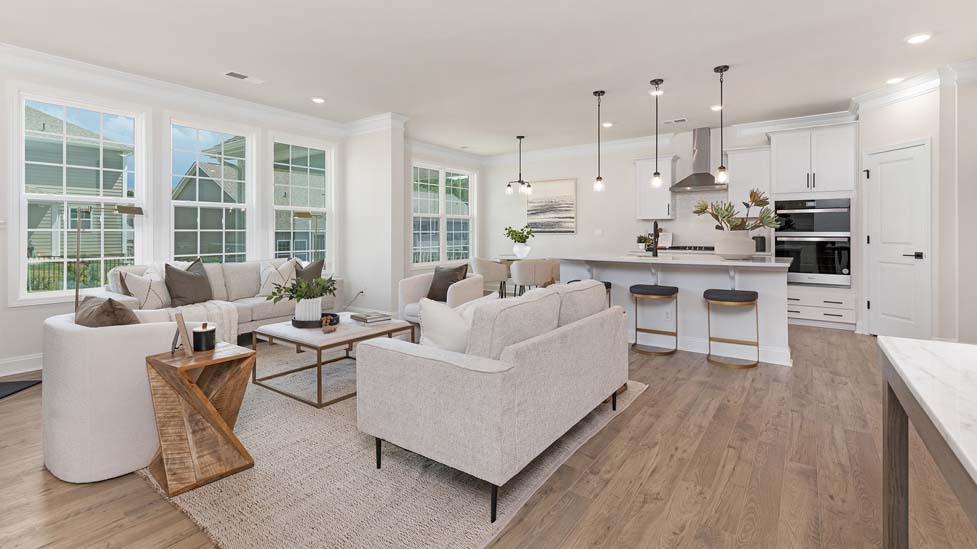 living room beside kitchen with electric fireplace