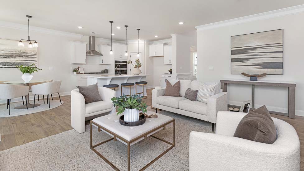 living room beside kitchen with electric fireplace