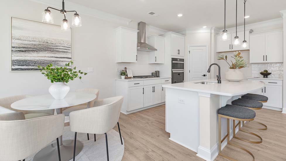 Kitchen and island with stainless steel appliances