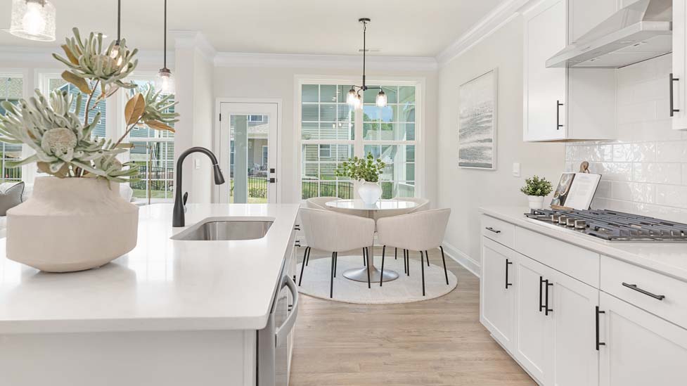 Kitchen and island with stainless steel appliances