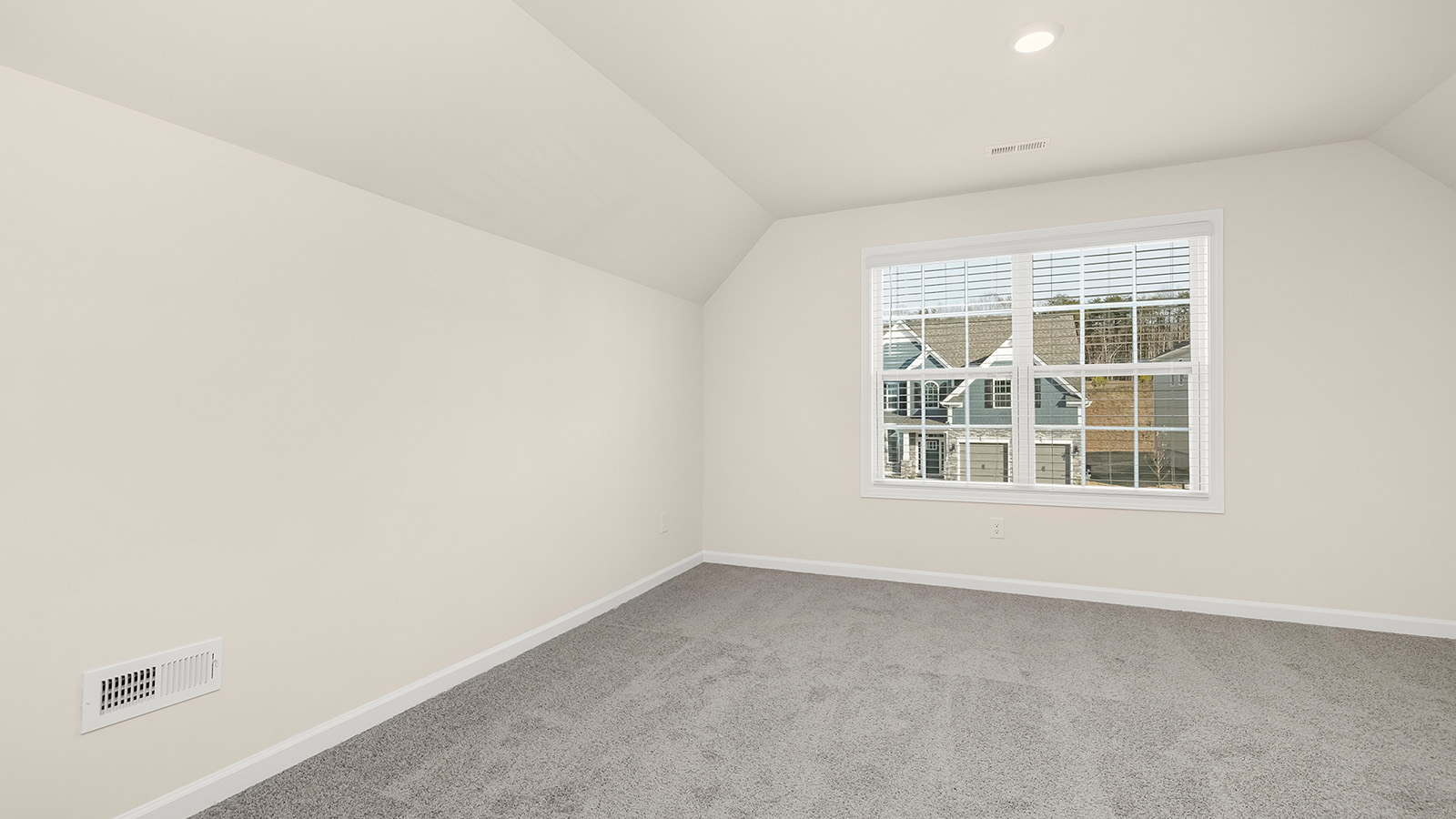 Carpeted bedroom with 3 windows