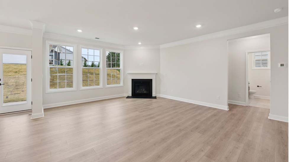 Family room with wood floors and fireplace