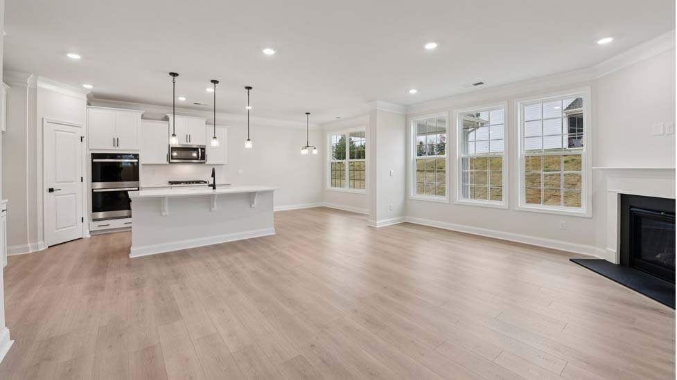 Family room with wood floors and fireplace
