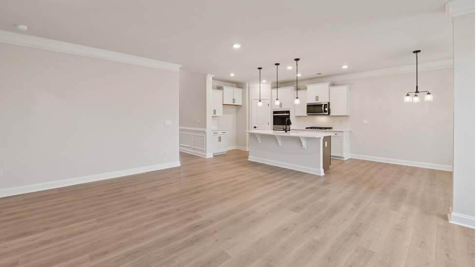 Family room with wood floors and fireplace