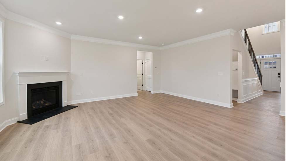Family room with wood floors and fireplace