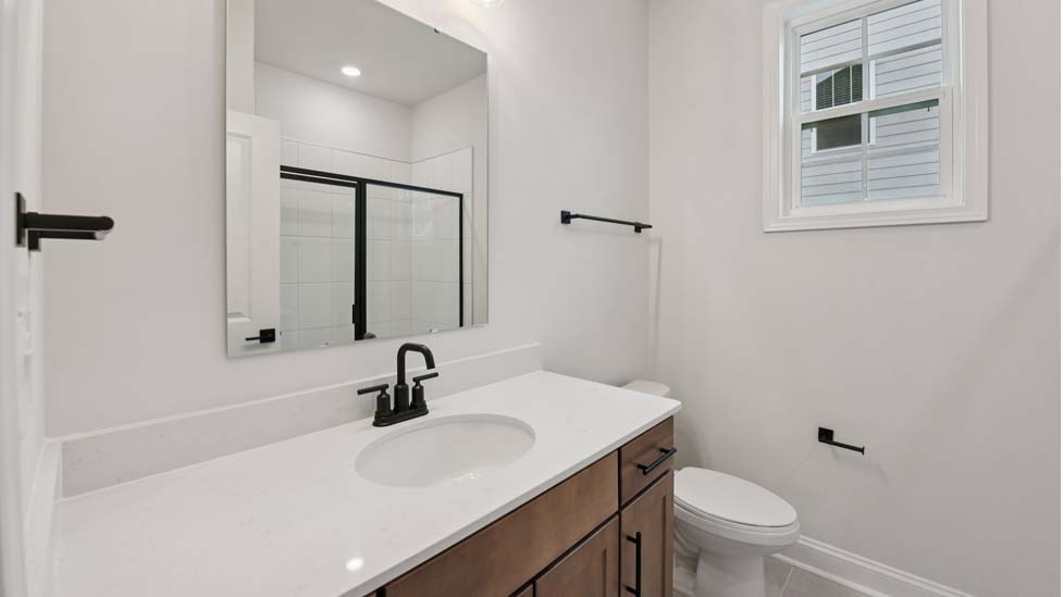 Bathroom with bathtub and white cabinet