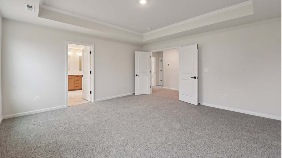 Carpeted bedroom with 3 windows