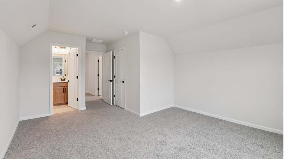 Carpeted bedroom with 3 windows