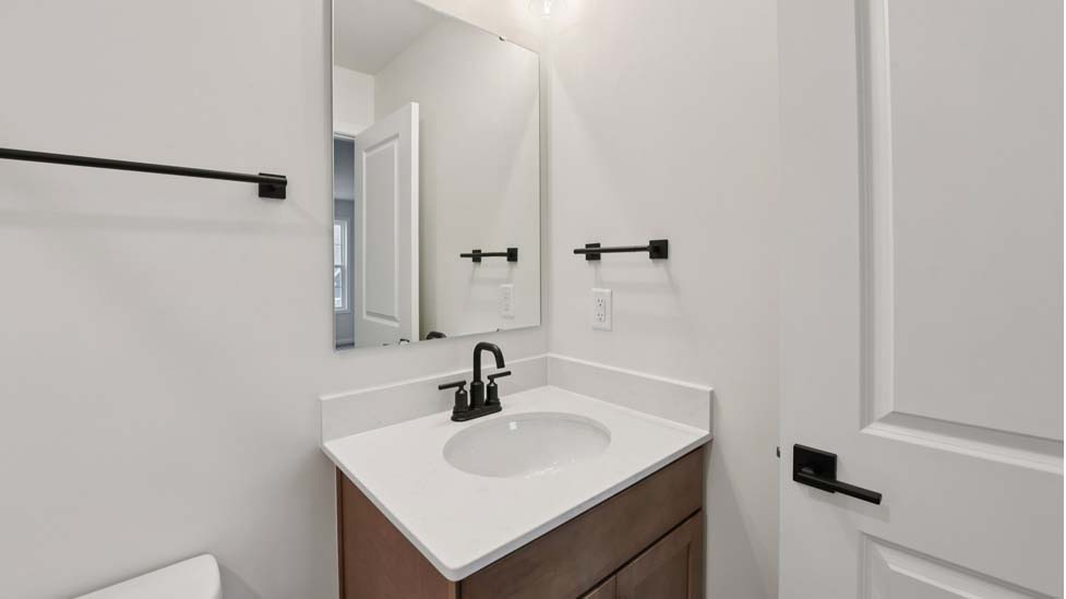 Bathroom with bathtub and white cabinet