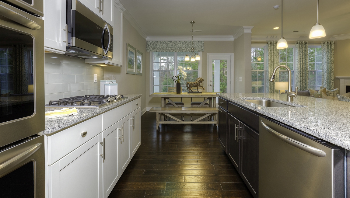 Kitchen and island with white cabinets