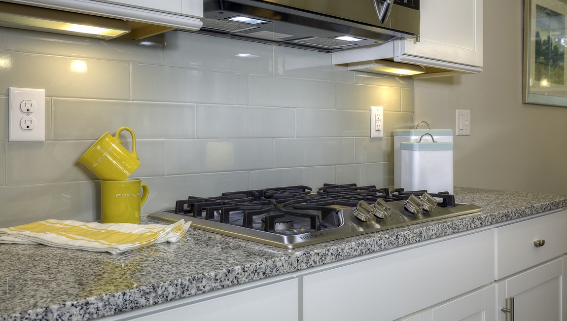 Kitchen and island with white cabinets