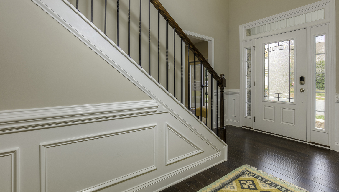 Welcoming foyer, view of stairs and front door