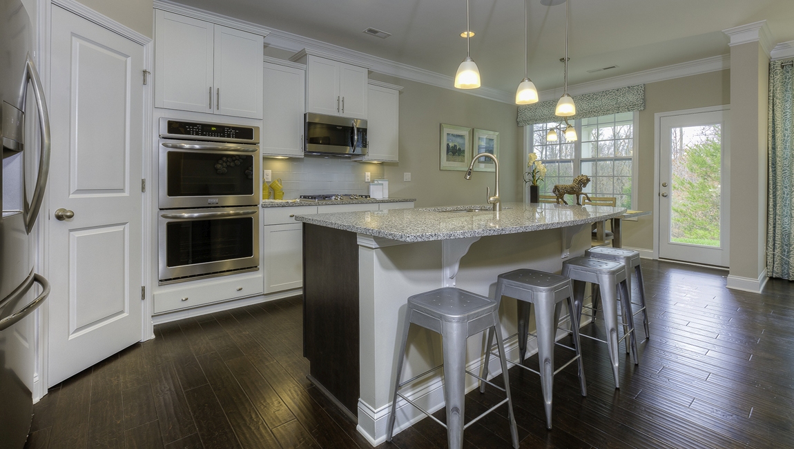 Kitchen and island with white cabinets